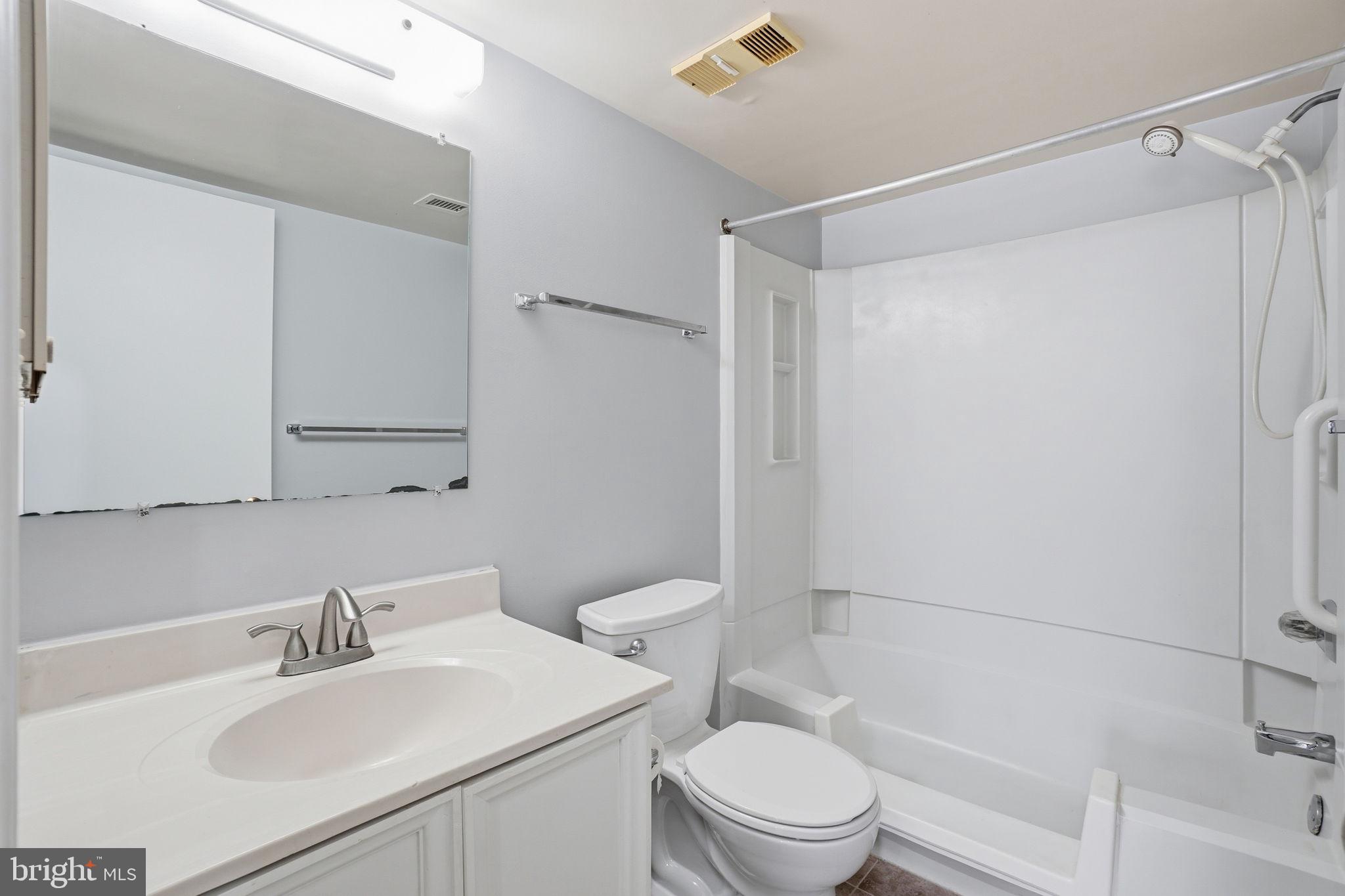 5902 Cove Landing Road, Unit 203 Burke, VA 22015 - Photo 23 of 25 a bathroom with a sink toilet and shower
