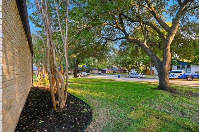 a view of a kitchen with wooden floor