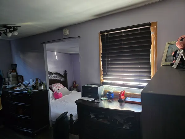 a room that has a couch and a stove in it