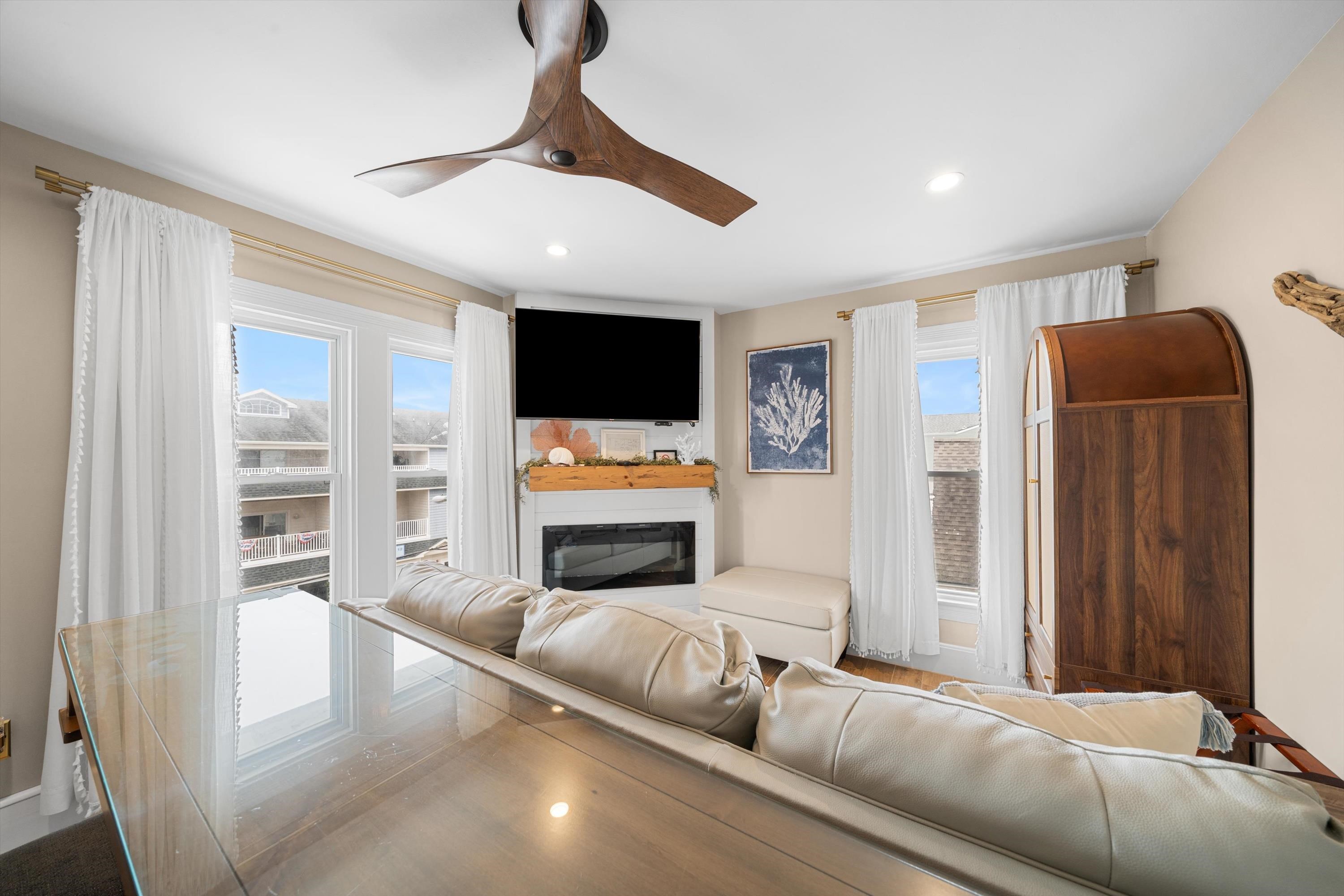 4600 Landis Avenue, Unit 3B Sea Isle City, NJ 08243 - Photo 12 of 29 a living room with furniture and a flat screen tv