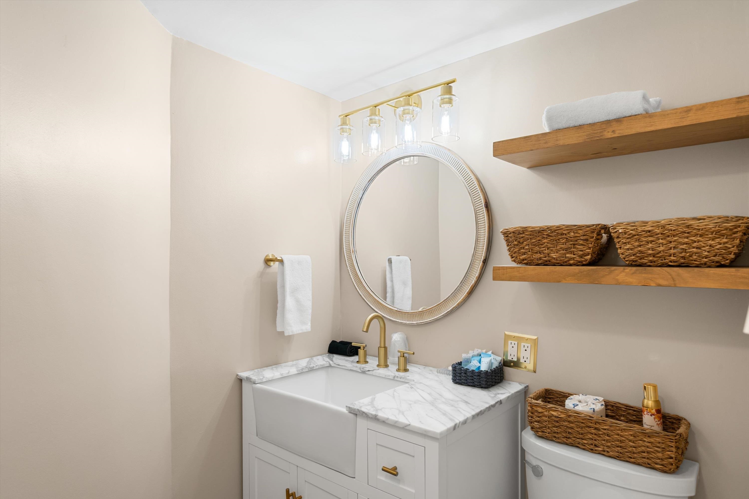 4600 Landis Avenue, Unit 3B Sea Isle City, NJ 08243 - Photo 16 of 29 a bathroom with a granite countertop sink and a mirror