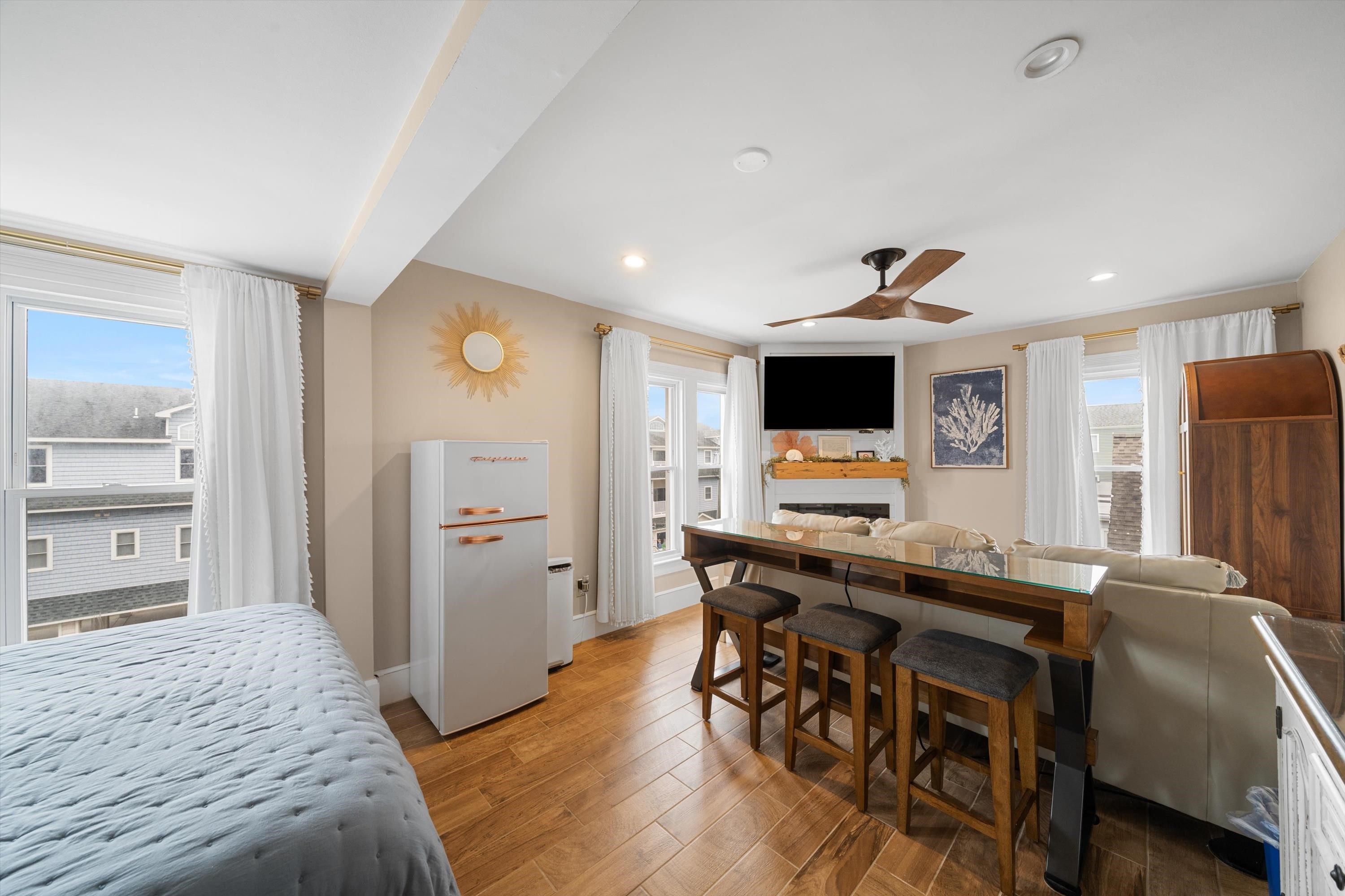 4600 Landis Avenue, Unit 3B Sea Isle City, NJ 08243 - Photo 2 of 29 a view of a workspace with furniture and wooden floor
