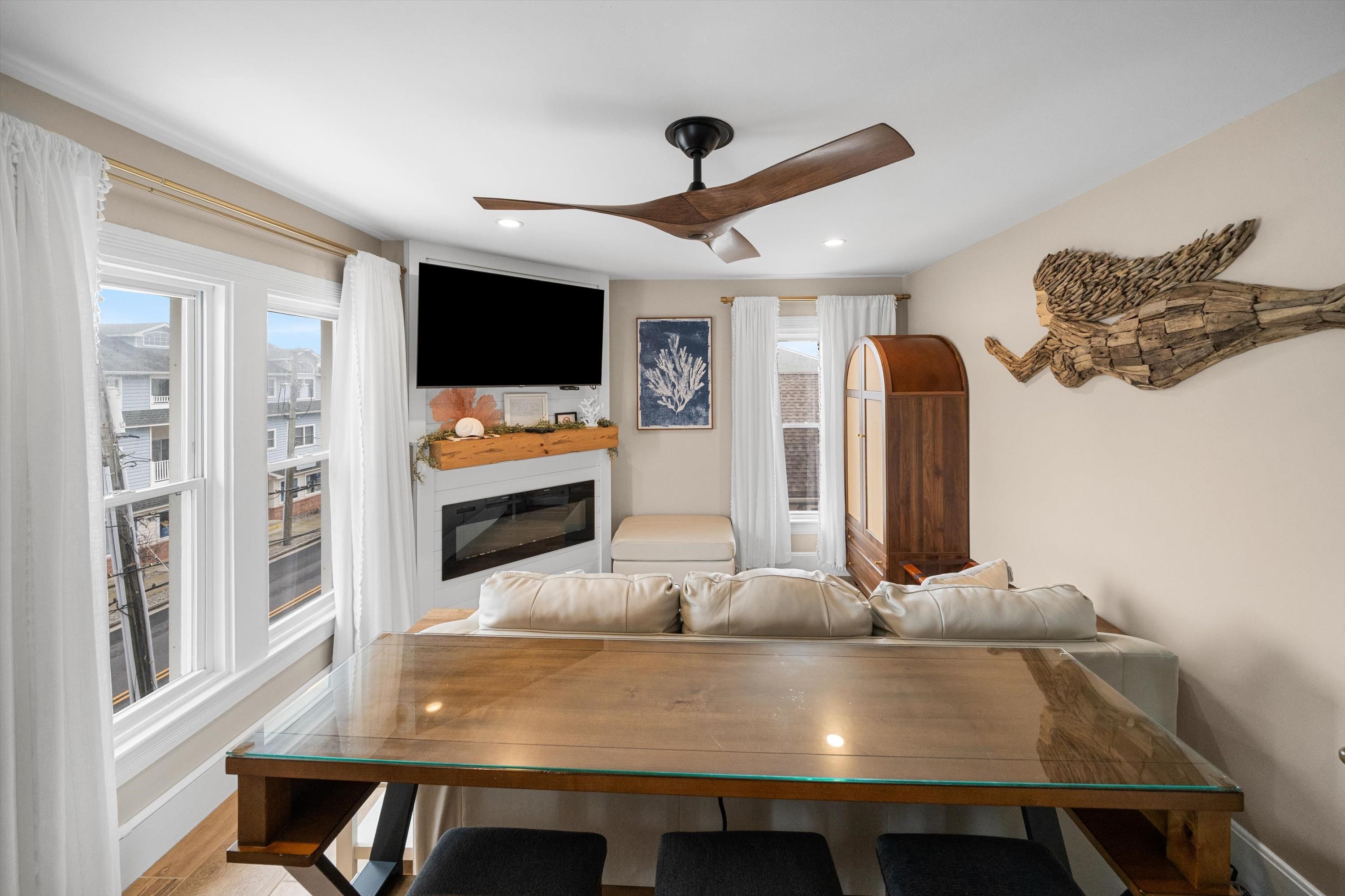 4600 Landis Avenue, Unit 3B Sea Isle City, NJ 08243 - Photo 4 of 29 a living room with furniture pool table and flat screen tv