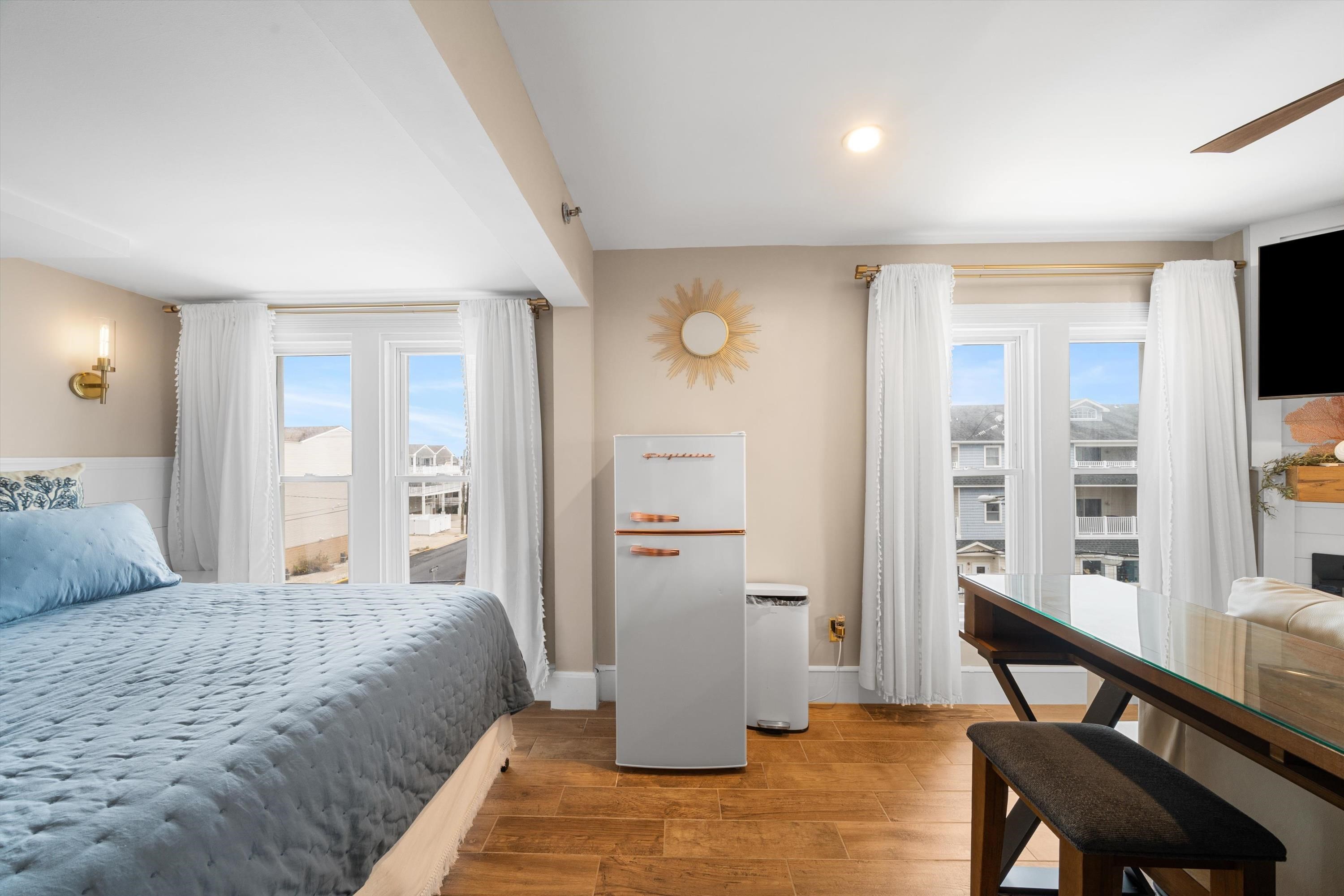 4600 Landis Avenue, Unit 3B Sea Isle City, NJ 08243 - Photo 8 of 29 a bedroom with a bed and a flat screen tv