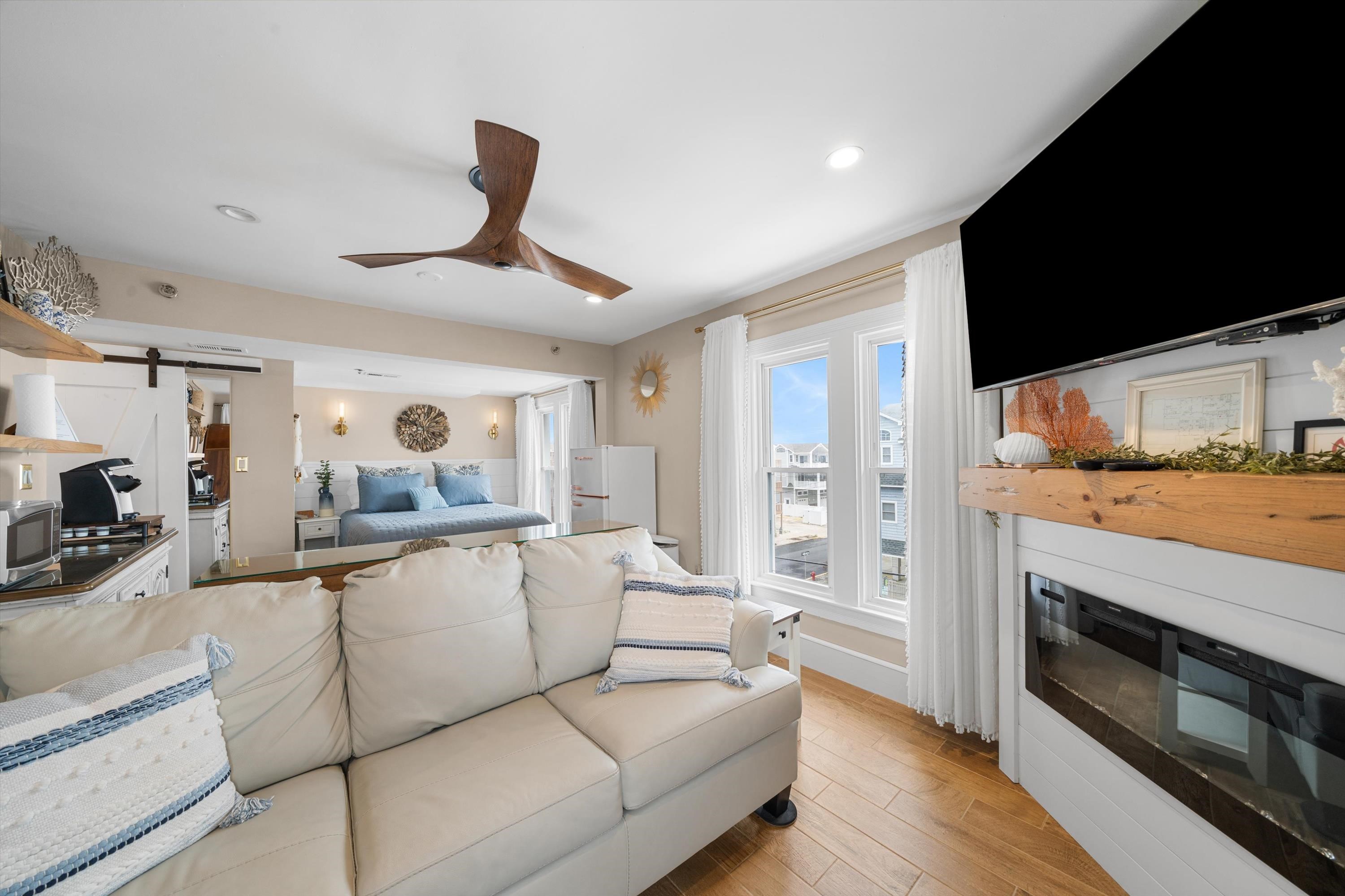 4600 Landis Avenue, Unit 3B Sea Isle City, NJ 08243 - Photo 10 of 29 a living room with furniture and a fireplace