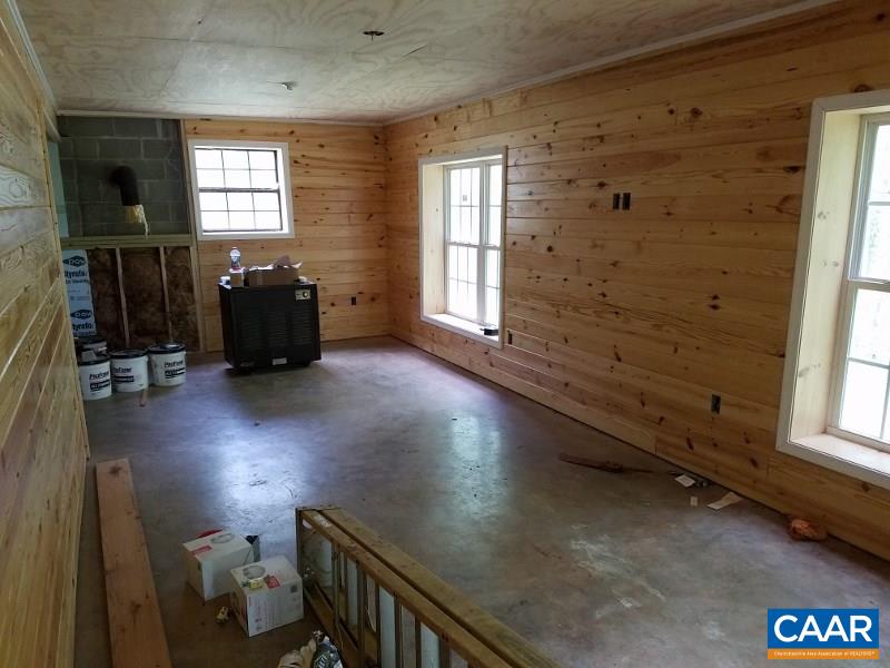11776 Howardsville Road Howardsville, VA 24562 - Photo 3 of 11 a view of a livingroom with wooden floor and windows