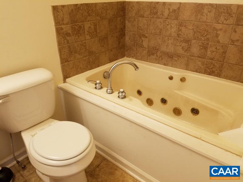 11776 Howardsville Road Howardsville, VA 24562 - Photo 10 of 11 a bathroom with a toilet and a sink