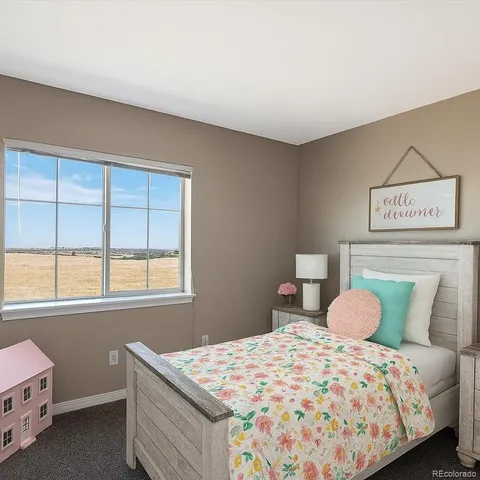 a bed room with furniture and a flat screen tv