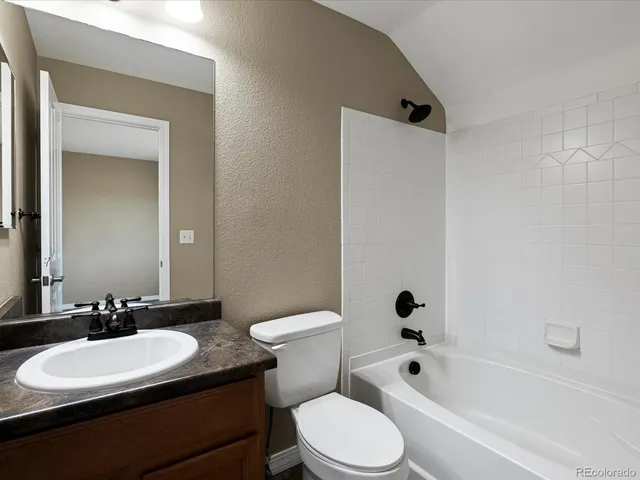 an aerial view of a house with a lake view