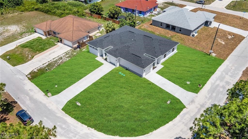 4768 Nelson Drive Lehigh Acres, FL 33973 - Photo 3 of 30 an aerial view of a house
