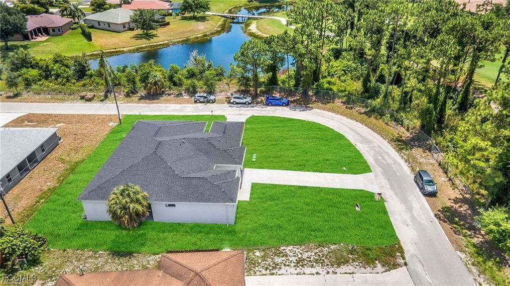 4768 Nelson Drive Lehigh Acres, FL 33973 - Photo 4 of 30 a view of a garden with a bench