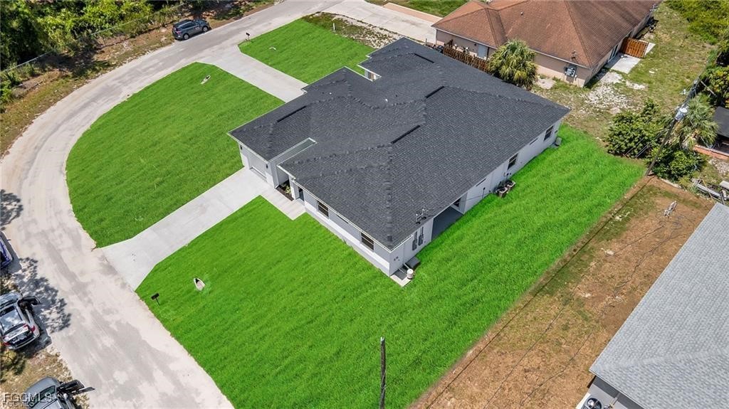4768 Nelson Drive Lehigh Acres, FL 33973 - Photo 5 of 30 an aerial view of a house