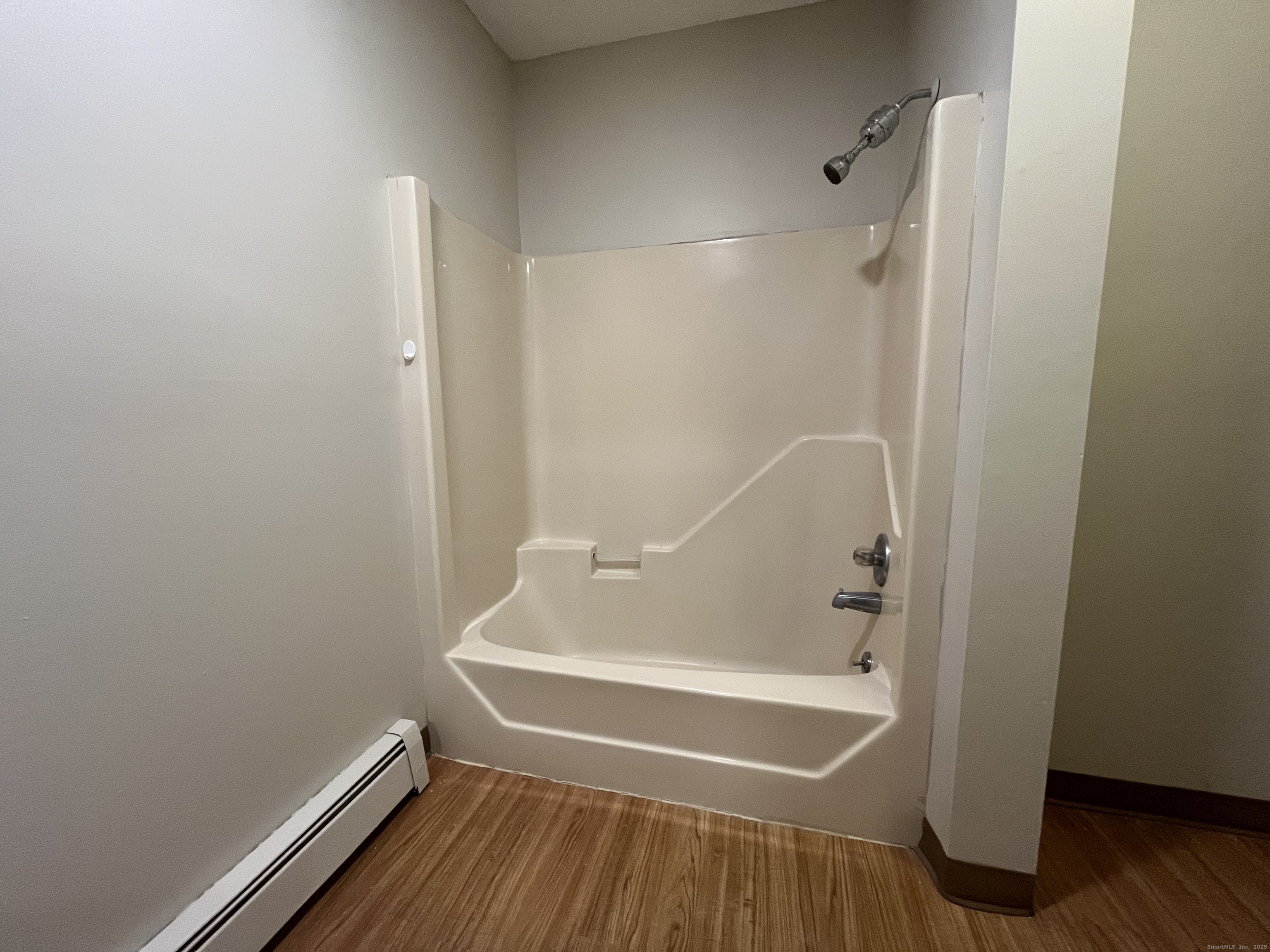 19 Divinity Street, Unit 3E Bristol, CT 06010 - Photo 11 of 16 a bathroom with a tub and shower