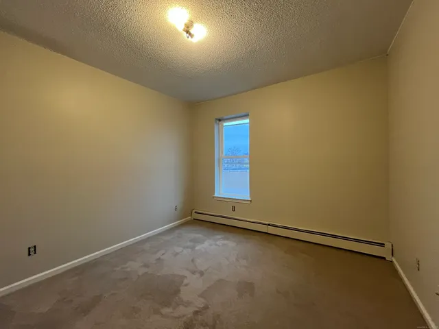 an empty room with a empty space and window