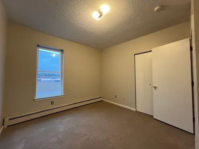 an empty room with a empty space and windows