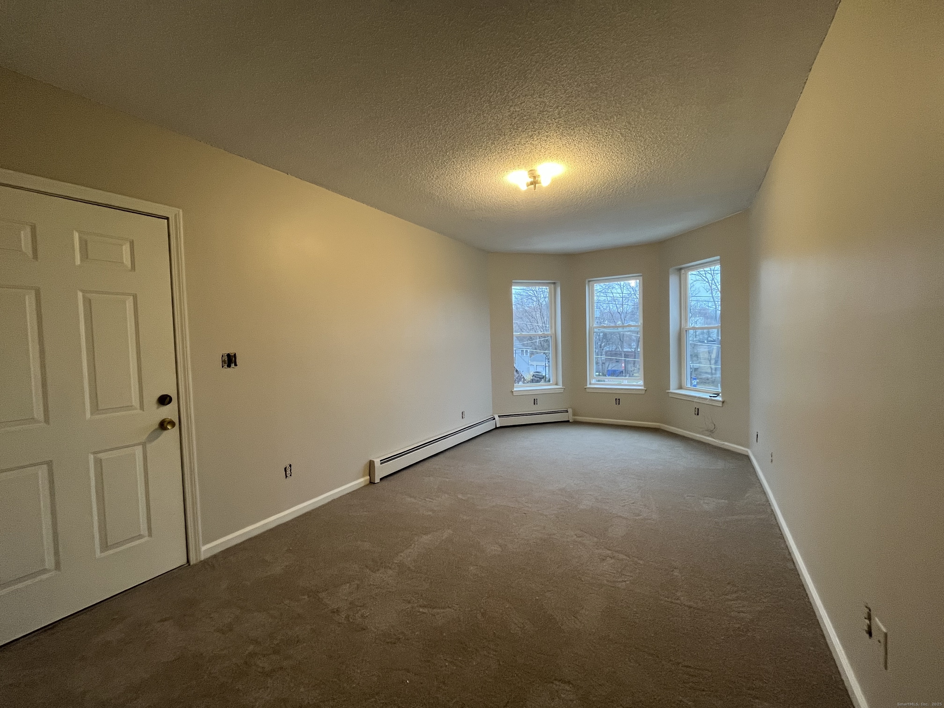 19 Divinity Street, Unit 3E Bristol, CT 06010 - Photo 8 of 16 a view of an empty room with a window