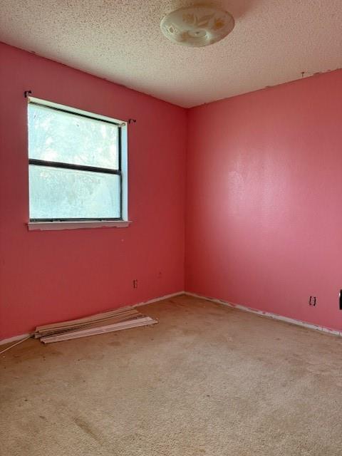 329 Walnut Avenue Azle, TX 76020 - Photo 4 of 13 an empty room with a window