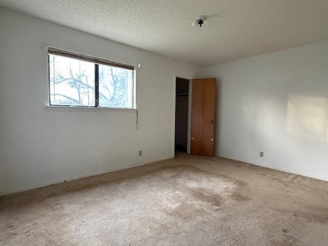 329 Walnut Avenue Azle, TX 76020 - Photo 5 of 13 an empty room with a window