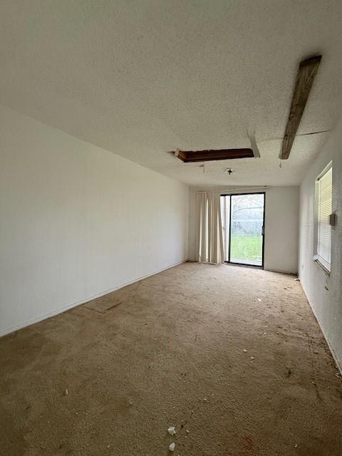 329 Walnut Avenue Azle, TX 76020 - Photo 8 of 13 a view of an empty room with a window