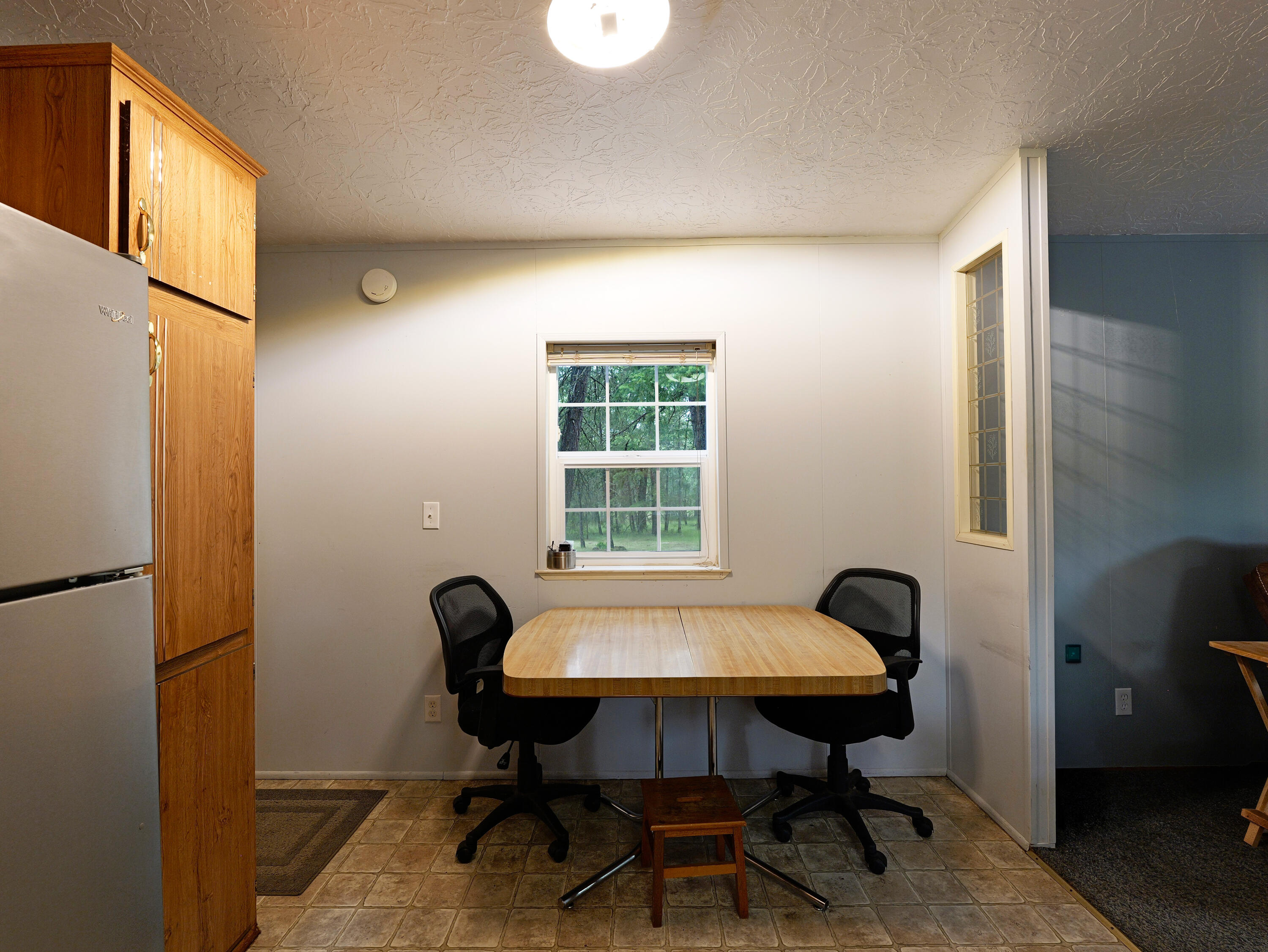 42256 Highway 62 Prospect, OR 97536 - Photo 8 of 48 a view of a workspace with furniture and a window