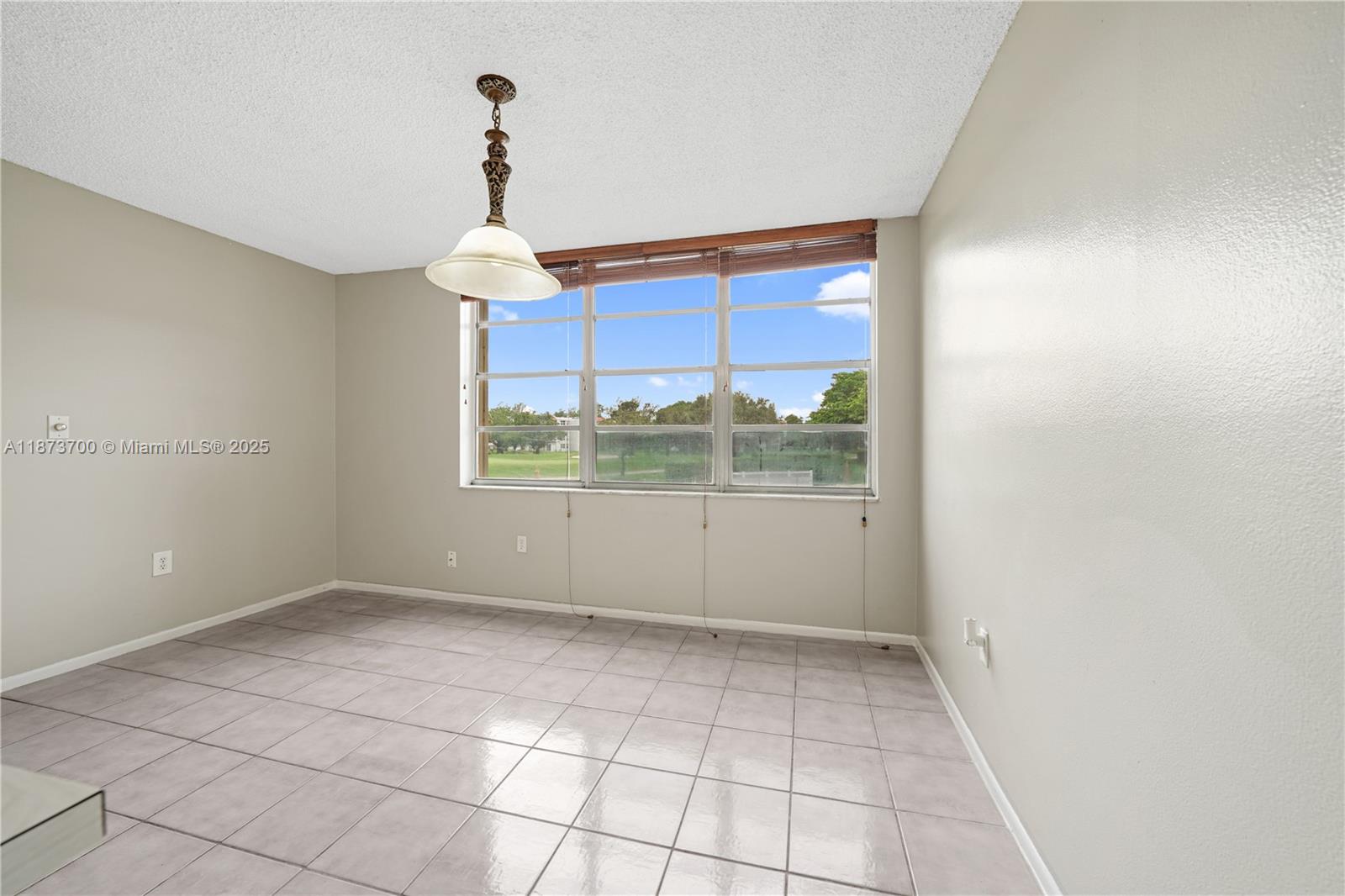 9491 Evergreen Place, Unit 207 Davie, FL 33324 - Photo 13 of 42 a view of an empty room with a window