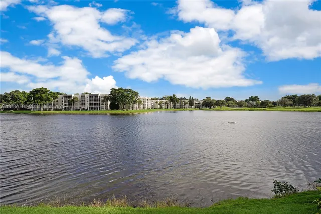 a view of a lake with houses in the background