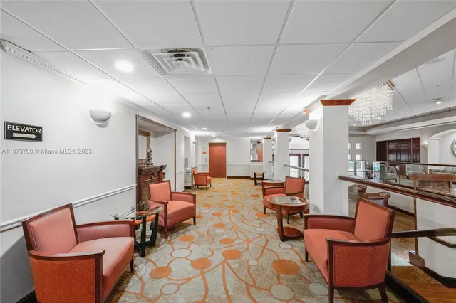an aerial view of residential houses with outdoor space and lake view