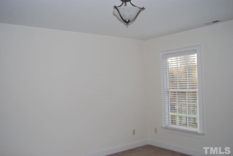 10312 Rougemont Road Bahama, NC 27503 - Photo 11 of 19 wooden floor in an empty room with a window