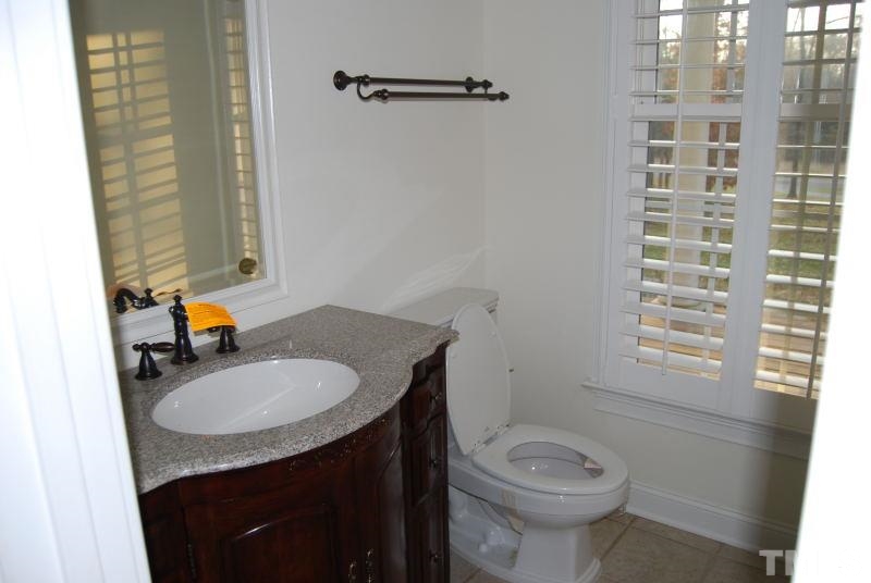 10312 Rougemont Road Bahama, NC 27503 - Photo 14 of 19 a bathroom with a sink toilet and shower