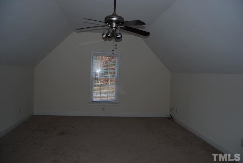 10312 Rougemont Road Bahama, NC 27503 - Photo 15 of 19 an empty room with a empty space and a window