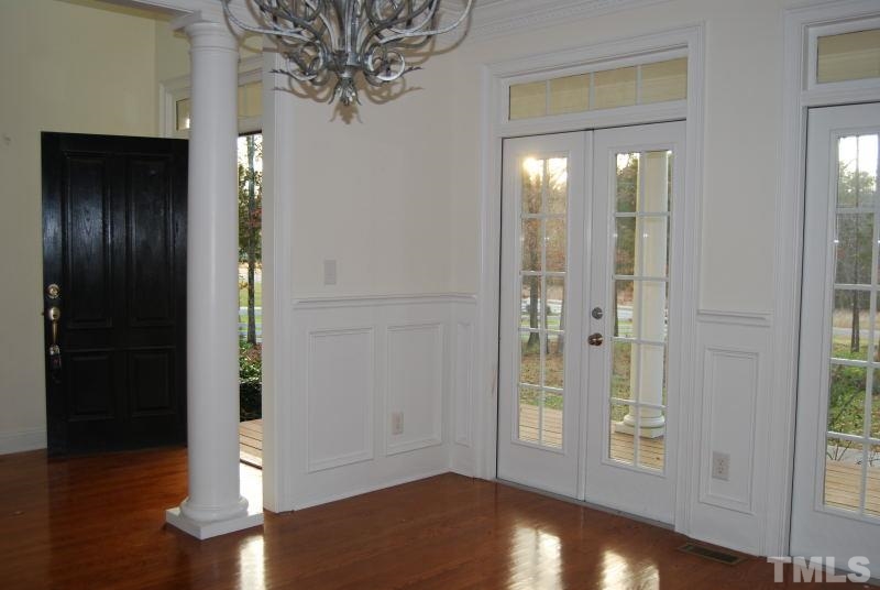 10312 Rougemont Road Bahama, NC 27503 - Photo 9 of 19 a view of a hallway with wooden floor