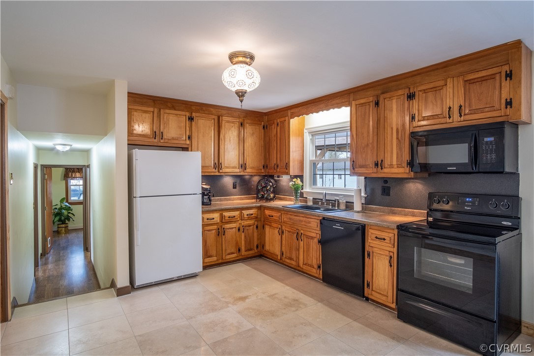 7466 Studley Road Mechanicsville, VA 23116 - Photo 14 of 34 a kitchen with stainless steel appliances granite countertop a stove top oven a sink dishwasher a refrigerator and a cabinets