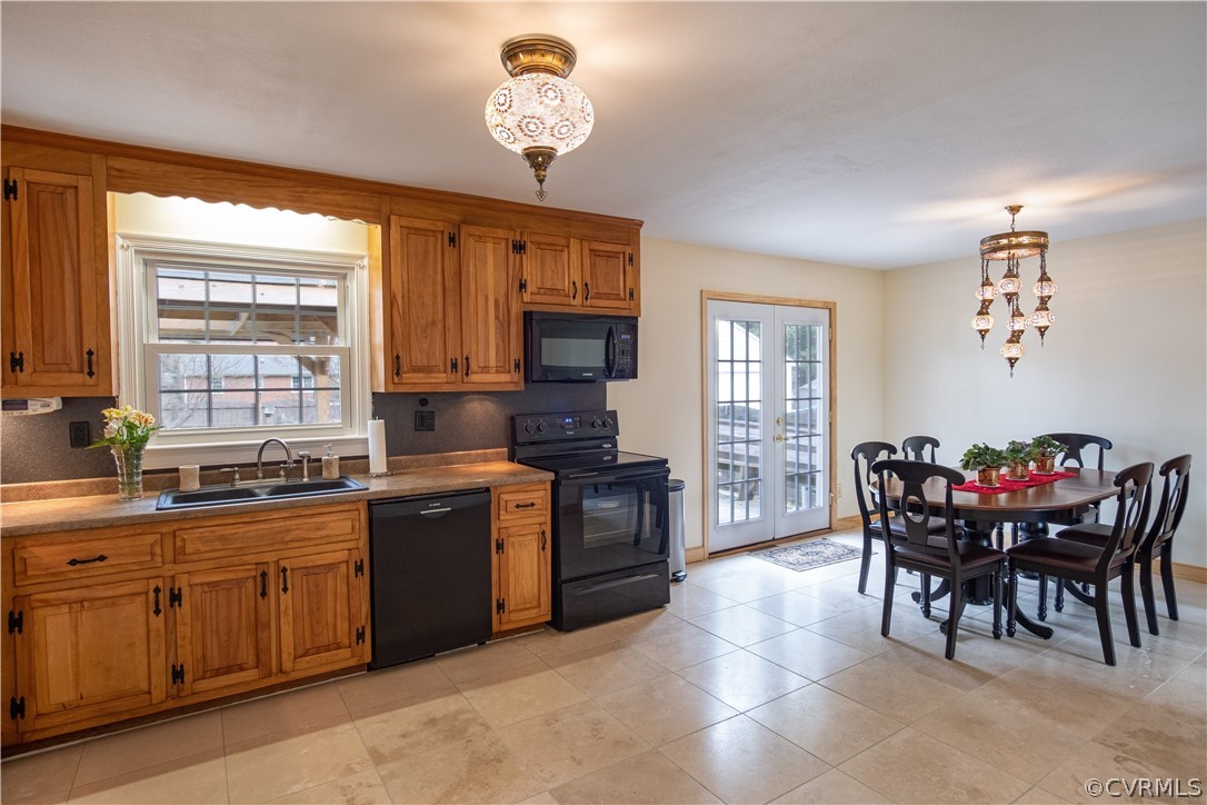 7466 Studley Road Mechanicsville, VA 23116 - Photo 15 of 34 a kitchen with a dining table chairs stainless steel appliances and cabinets