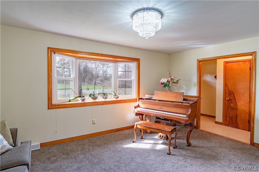 7466 Studley Road Mechanicsville, VA 23116 - Photo 17 of 34 a view of a room with a window and wooden floor