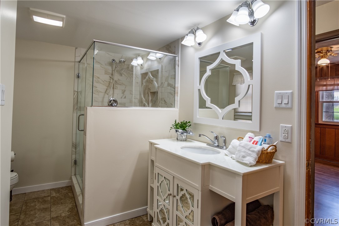 7466 Studley Road Mechanicsville, VA 23116 - Photo 22 of 34 a bathroom with a sink vanity and a mirror