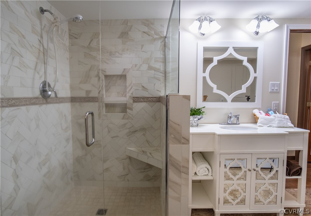 7466 Studley Road Mechanicsville, VA 23116 - Photo 23 of 34 a bathroom with a sink mirror and vanity