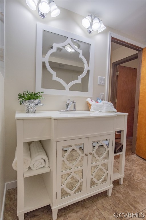 7466 Studley Road Mechanicsville, VA 23116 - Photo 24 of 34 a bathroom with a sink vanity and a mirror