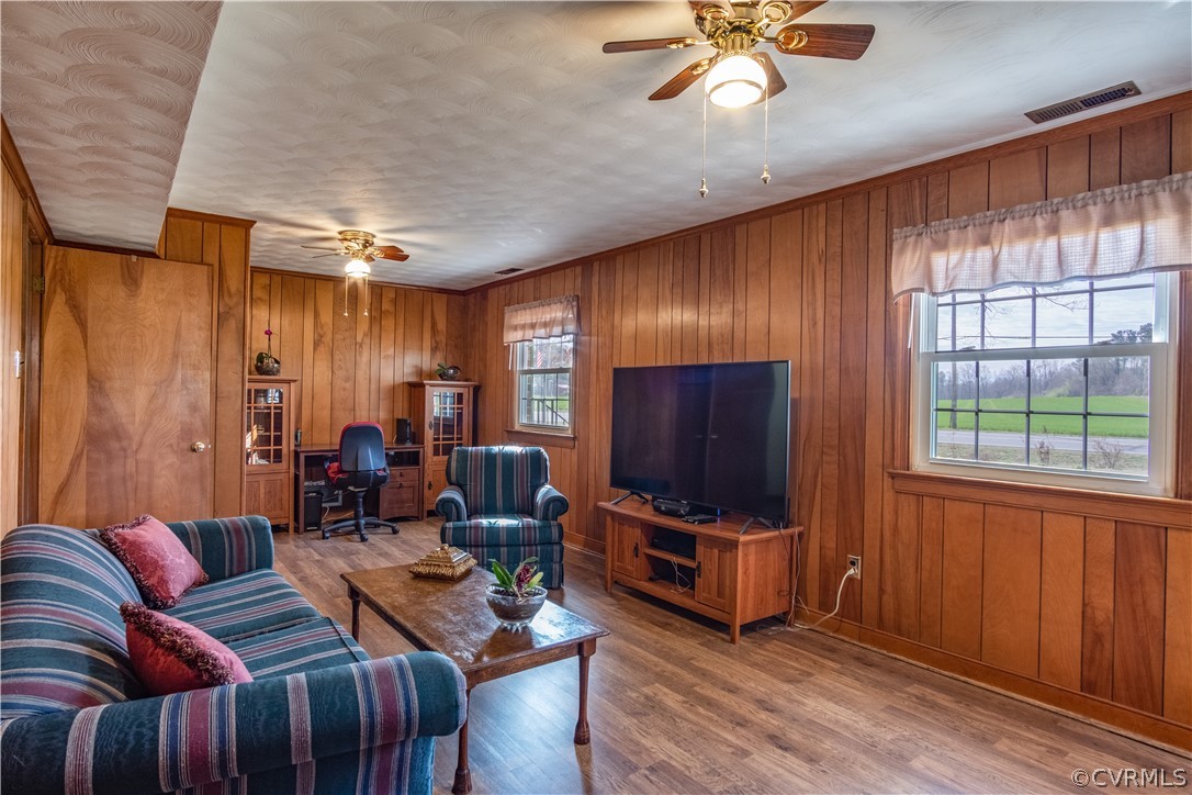 7466 Studley Road Mechanicsville, VA 23116 - Photo 27 of 34 a living room with furniture a ceiling fan and a window