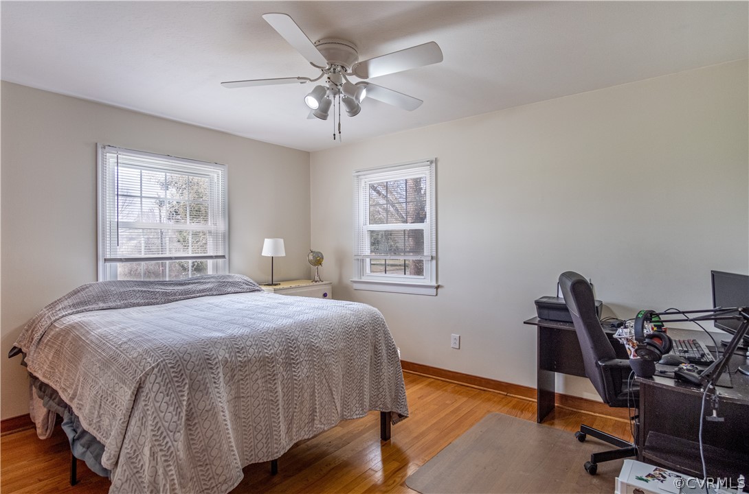 7466 Studley Road Mechanicsville, VA 23116 - Photo 30 of 34 a bedroom with a bed a desk and chair