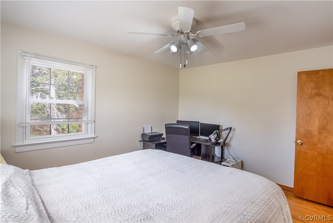 7466 Studley Road Mechanicsville, VA 23116 - Photo 31 of 34 a bedroom with a bed and wooden floor