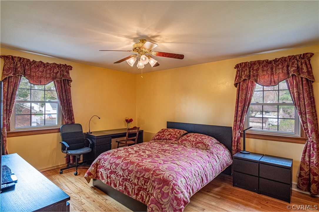 7466 Studley Road Mechanicsville, VA 23116 - Photo 32 of 34 a bedroom with a bed a dresser next to a window