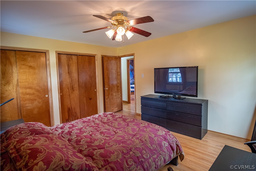 7466 Studley Road Mechanicsville, VA 23116 - Photo 33 of 34 a bed room with a bed and a chandelier