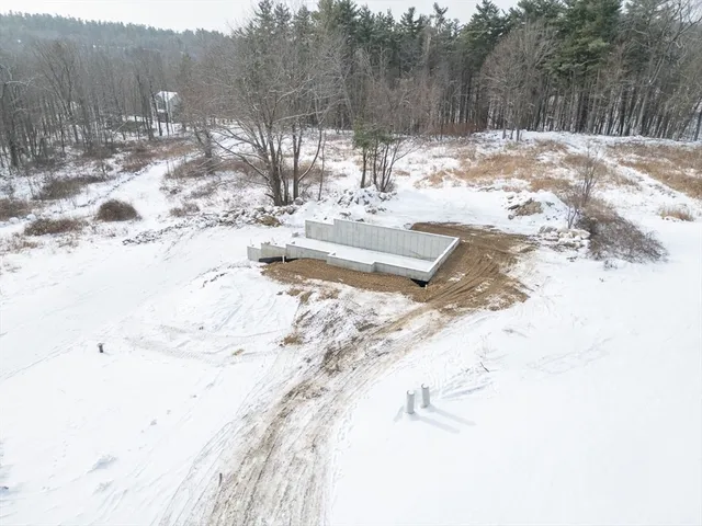 a view of a yard with snow on the road