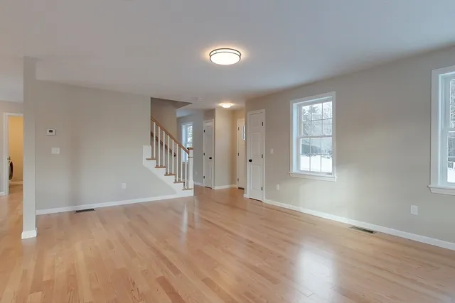 a view of kitchen with wooden floor and a window