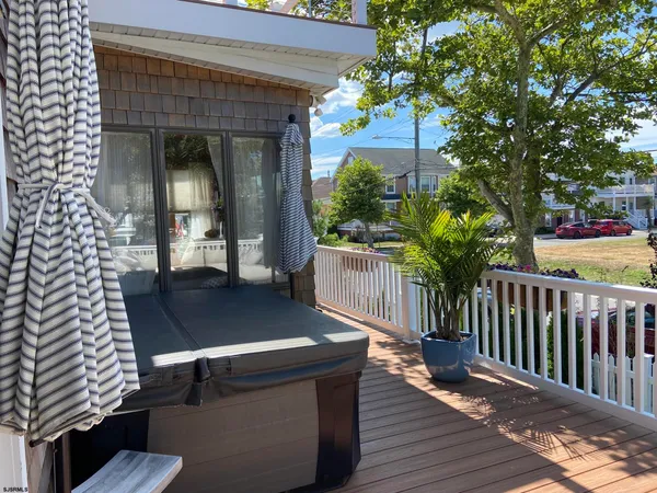 a balcony view with a seating space