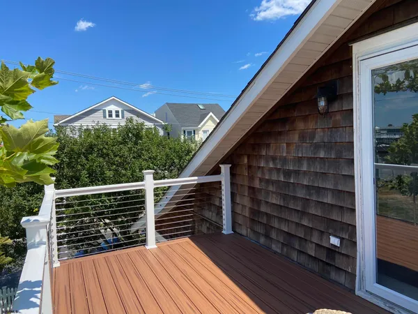 a view of a house with a yard and garden