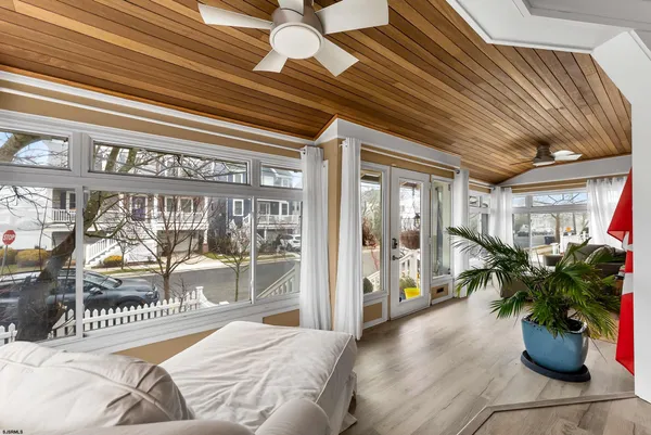 a bedroom with furniture and a potted plant