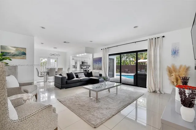 a living room with furniture and a rug