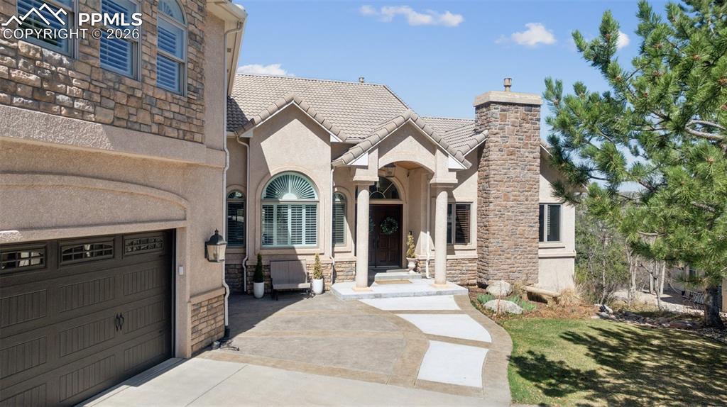 5039 Stonehill Road Colorado Springs, CO 80918 - Photo 2 of 50 a view of a house with a yard