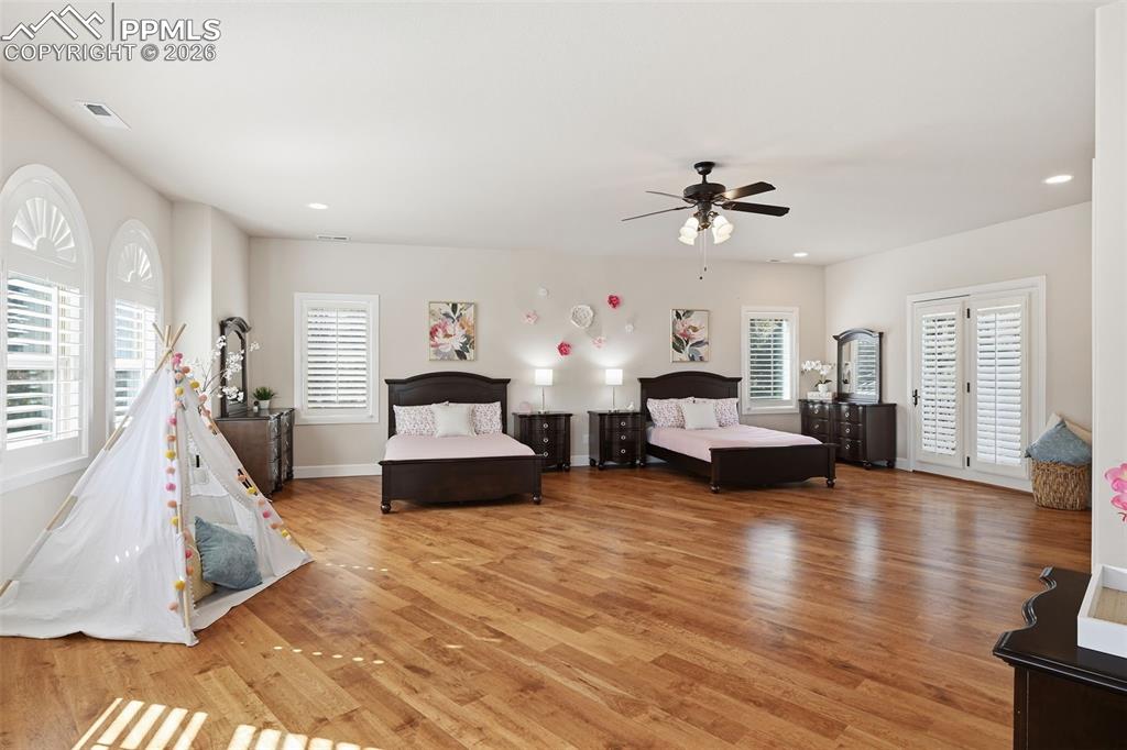5039 Stonehill Road Colorado Springs, CO 80918 - Photo 29 of 50 a living room with furniture and a chandelier